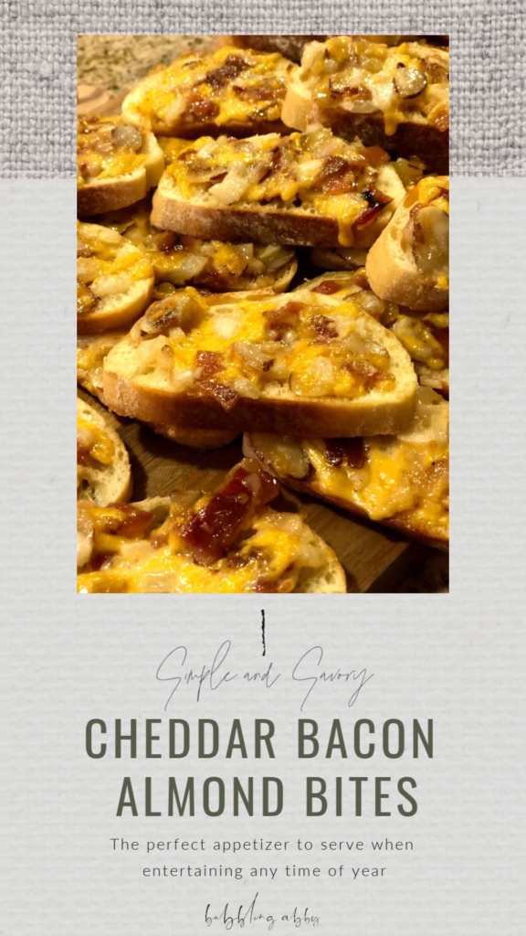 This cheddar almond bacon appetizer is a major palette pleaser, and the perfect dish to serve when entertaining ANY time of year! Crusty French bread slathered with a mixture of bacon, cheese, and mayo?! YES, PLEASE! #appetizer #bacon #cheese #partyfavorite #fingerfood #holiday #tailgate babblingabby.net 