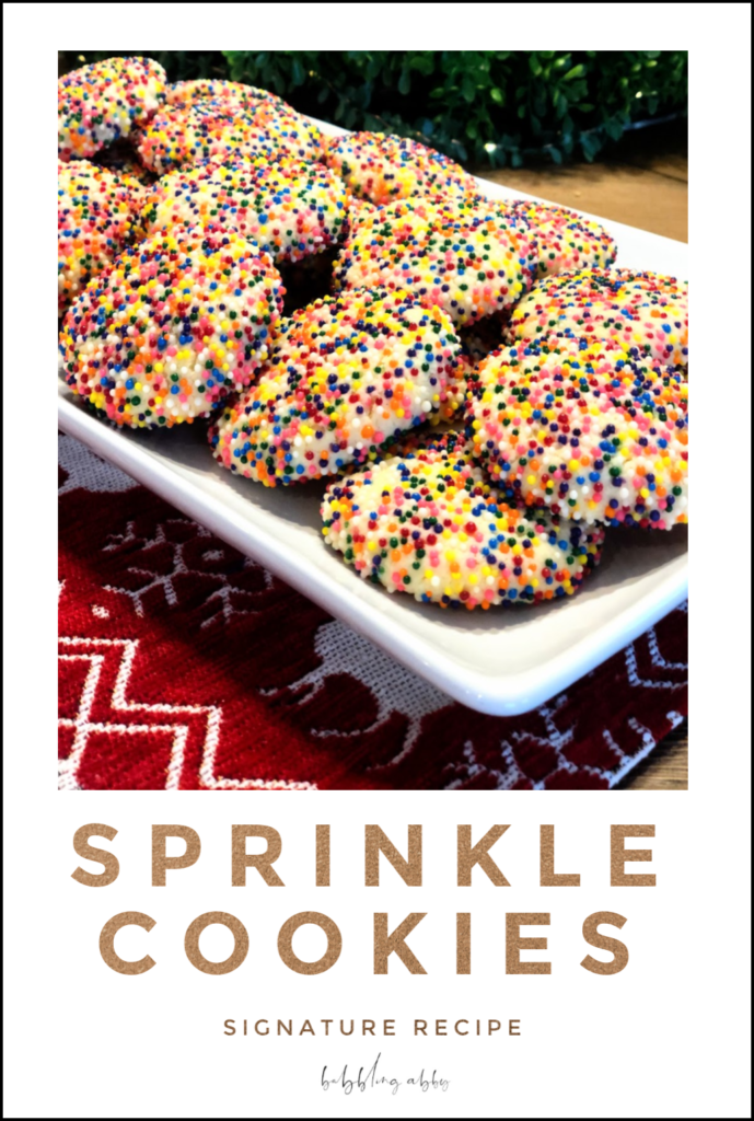 With its colorful exterior and soft and chewy middle, this Sprinkle Cookie promises to charm adults and children alike. No doubt, it will be the star of the party in all its sprinkly spunk! It’s become the Babbling Abby Signature Sprinkle cookie - a go-to for the annual Christmas cookie party! #cookie #cookies #cookierecipe #sprinkles #Christmascookie #holidaytreat #partyfavorite #sprinklecookie #holiday #funfood #cookieparty babblingabby.net